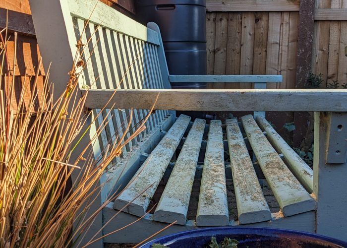 A comfortable blue/green bench seat